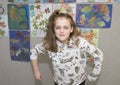 Eleven year old girl in humorous mean girl pose