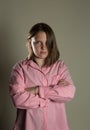 Eleven year old girl in oversized pink blouse Royalty Free Stock Photo