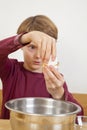 Eleven years old boy opening an egg