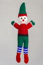 Elf doll - elf doll with red shirt, green pants, black belt and white and blue socks and a green hat with a red ribbon Royalty Free Stock Photo