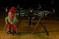 Elf holds a Hexacopter with camera in hdr