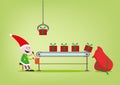 An elf operates the assembly line for Santa Claus giftgiving factory