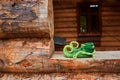 Elf shoes in the window opening of an old wooden house Royalty Free Stock Photo