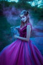 Elf woman in violet dress Royalty Free Stock Photo