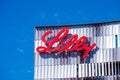 Eli Lilly logo sign atop Lilly Biotechnology Center campus of an American pharmaceutical company Eli Lilly and Company