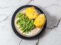elicious malaysian food cendol durian in a black bowl with iced sweet, coconut milk, green rice and palm sugar isolated on grey Royalty Free Stock Photo
