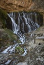 Elif Waterfall, Kapuzbasi Waterfall in Aladaglar National Park Green trees round the waterfall