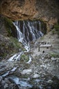 Elif Waterfall, Kapuzbasi Waterfall in Aladaglar National Park Green trees round the waterfall