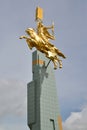 ELISTA, RUSSIA. A monument The golden rider against the background of the sky