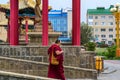 ELISTA, RUSSIA - MAY 6, 2018: Buddhist monk walks near temple in Elista