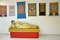 ELISTA, RUSSIA. A sculpture of the lying Buddha Shakyamuni and fabric icons tanks. National museum of Kalmykia of N. N. Palmov Royalty Free Stock Photo