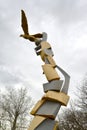 ELISTA, RUSSIA. A street sculpture of a golden eagle with a soccerball about an entrance on Uralan stadium. Kalmykia