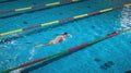 Elite female swimmer during a front crawl swimming training Royalty Free Stock Photo