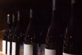 Elite wine bottles, dark wine background
