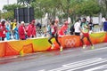 Eliud Kipchoge and Feyisa Lilesa at marathon aid stations Royalty Free Stock Photo