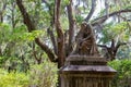 Eliza Wilhelmina Theus statute amidst the spanish moss in Bonaventure Cemetery in Savannah, Georgia