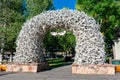 Elk Antler Arch at the entrance to Town Square. Green trees - Jackson Hole, Wyoming, USA - September, 2020