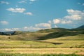 Elk Graze As Work Trucks Descend The Old Gardiner Road In Yellowstone Royalty Free Stock Photo