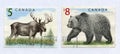 Elk and grizzly on canadian post stamps Royalty Free Stock Photo
