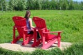 Elk Island National Park, Alberta, Canada - June 24, 2017 - A young woman enjoying the view on the Bison Loop Road as part of the