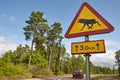 Elk moose traffic road signal on a finnish landscape.