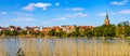 Panorama of Elk historic city center with Holiest Heart of Jesus church at Jezioro Elckie lake in Elk town in Poland