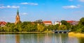 Panorama of Elk historic city center with neo-gothic church tower on shore of Jezioro Elckie lake in Elk town in Poland