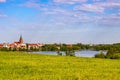 Panorama of Elk historic city center with neo-gothic church on shore of Jezioro Elckie lake in Elk town in Poland