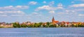 Panorama of Elk historic city center with neo-gothic church tower on shore of Jezioro Elckie lake in Masuria region of Poland