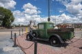 Elk statue and rustic old car at Grand canyon railway junction during summer