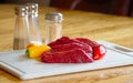 Elk steaks, raw with peppers Royalty Free Stock Photo