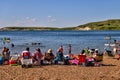 Elkwater Lake - July 1, 2021: Visitors on the beach at Elkwater Lake in the Cypress Hills region of Southern Alberta