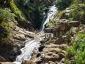Ella, Sri Lanka - March 9, 2022: Beautiful view of the Ravana Ella waterfall, 25 meters high. People came to the waterfall and