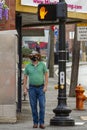 Cowboy with face mask is waiting at red light