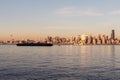 Elliott Bay, Seattle Bay, sunset light on skyscrapers of downtown in the background, Washington, USA