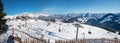 ELLMAU, TIROL/AUSTRIA, December 30th 2019 - mountain panorama Skiwelt Hartkaiser slope with chairlift and lots of skiers Royalty Free Stock Photo