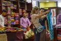 European tourist girls in oriental traditional textile store