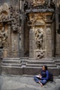 Ellora, Maharashtra, INDIA - JANUARY 15, 2018: Girl student makes a drawing while in the Kailash Temple