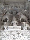 Damaged carving of Lakshmi, Goddess of Wealth & principle aspect of the Mother goddess, sitting on a lotus throne, Kailasa, Ellora