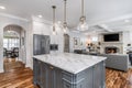 A beautiful, luxurious kitchen looking towards the living room