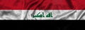 Elongated national flag of Iraq with a fabric texture fluttering in the wind. Iraqi flag for website design. 3d