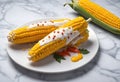 elote, grilled mexican street corn on the cob with cream sauce, seasoned with chili powder