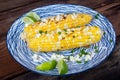 Elote Mexican corn with cheese herbs and lime