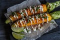 Elote or Mexican grilled corn on the cob served with cotija cheese and chili powder. Royalty Free Stock Photo