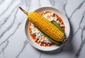 elote, a mexican grilled corn on the cob with sour cream and green pepper