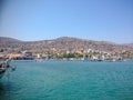 Elounda, Crete, Greece - September 2: View of the sea bay with boats. Mountains are visible in the distance