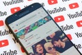 ElrubiusOMG official youtube channel on smartphone screen on paper youtube background