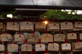 Ema are small wooden plaques, common to Japan, in which Shinto and Buddhist worshippers write prayers or wishes Royalty Free Stock Photo