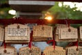 Ema are small wooden plaques, common to Japan, in which Shinto and Buddhist worshippers write prayers or wishes Royalty Free Stock Photo