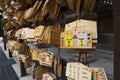 Ema, small wooden plaques with wishes and prayers at the Kushida jinja shrine in Fukuoka